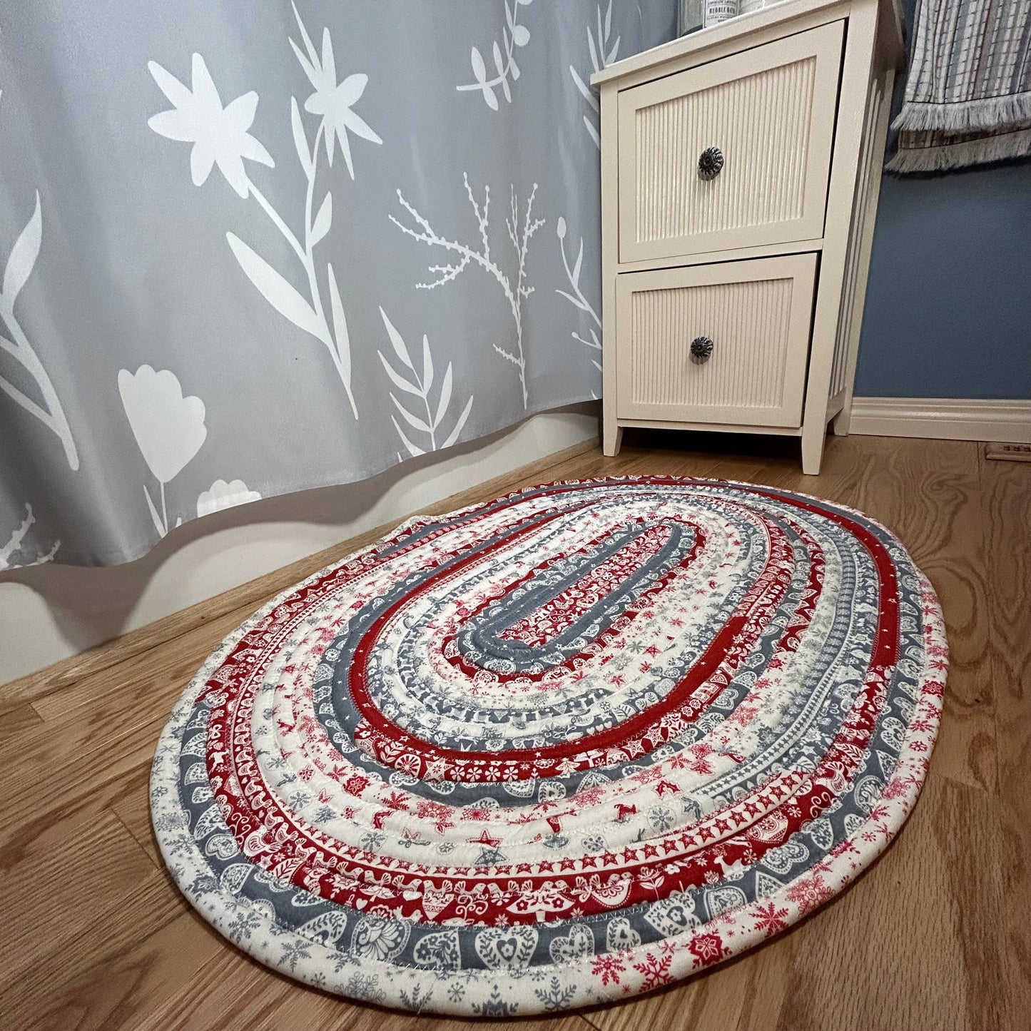 Scandinavian Christmas Print Handmade Cotton Jelly Roll Rug for Kitchen, Luxury Bathmat or Bedside Rug. Washable and reversible, this is a cozy cotton rug that will wash and wear for years to come. Made in Canada by Home Stitchery Decor