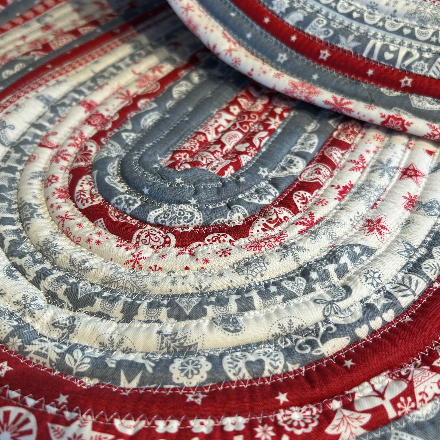 Scandinavian Christmas Print Handmade Cotton Jelly Roll Rug for Kitchen, Luxury Bathmat or Bedside Rug. Washable and reversible, this is a cozy cotton rug that will wash and wear for years to come. Made in Canada by Home Stitchery Decor