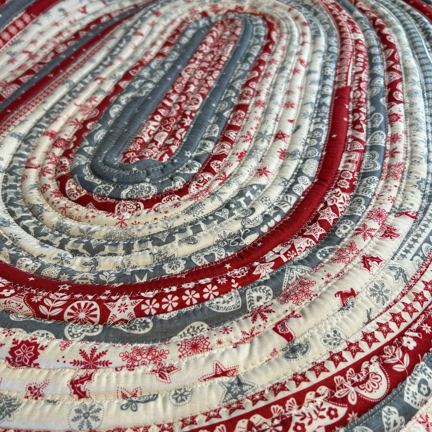 Scandinavian Christmas Print Handmade Cotton Jelly Roll Rug for Kitchen, Luxury Bathmat or Bedside Rug. Washable and reversible, this is a cozy cotton rug that will wash and wear for years to come. Made in Canada by Home Stitchery Decor