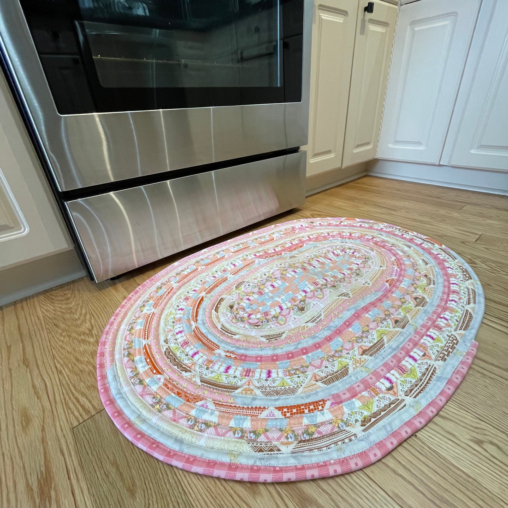 Handmade washable pink cotton Jelly Roll Rug for Kitchen, bedside or bathroom. Made in Canada